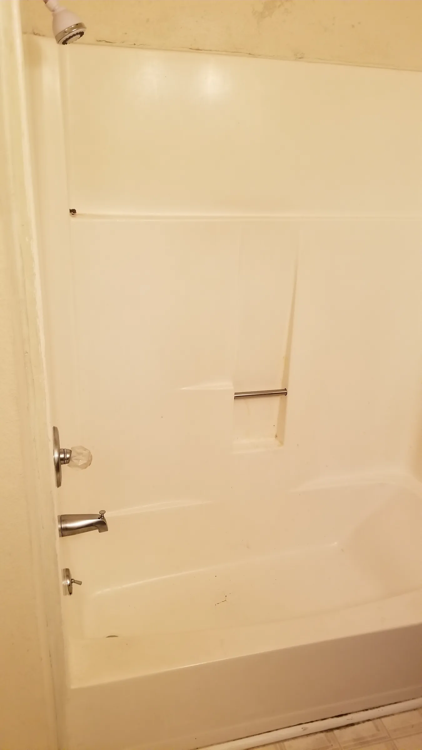 Before: the original tub-shower, full height.