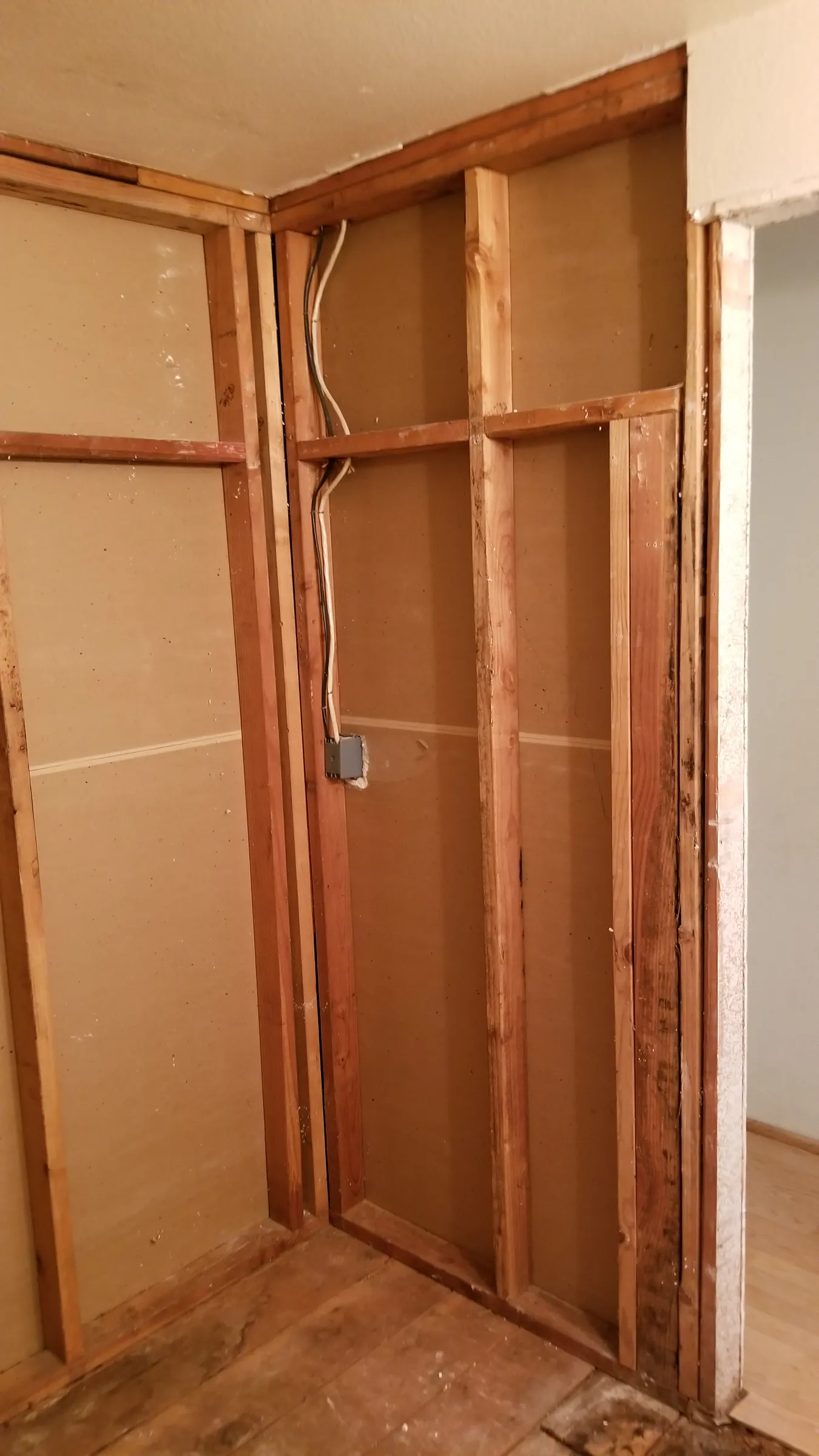 Tub alcove opened to the studs.