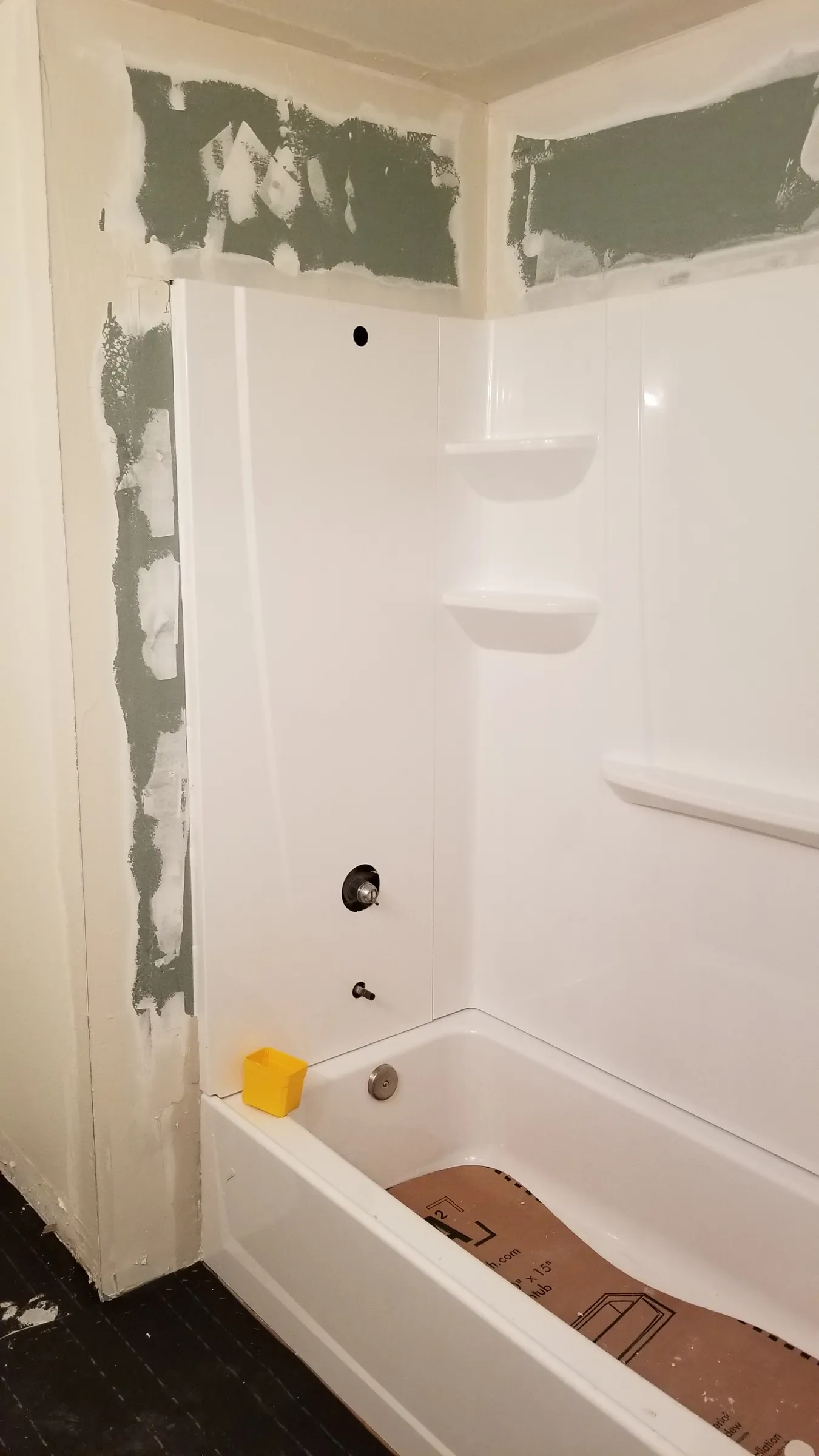 Drywall patched around the new surround.