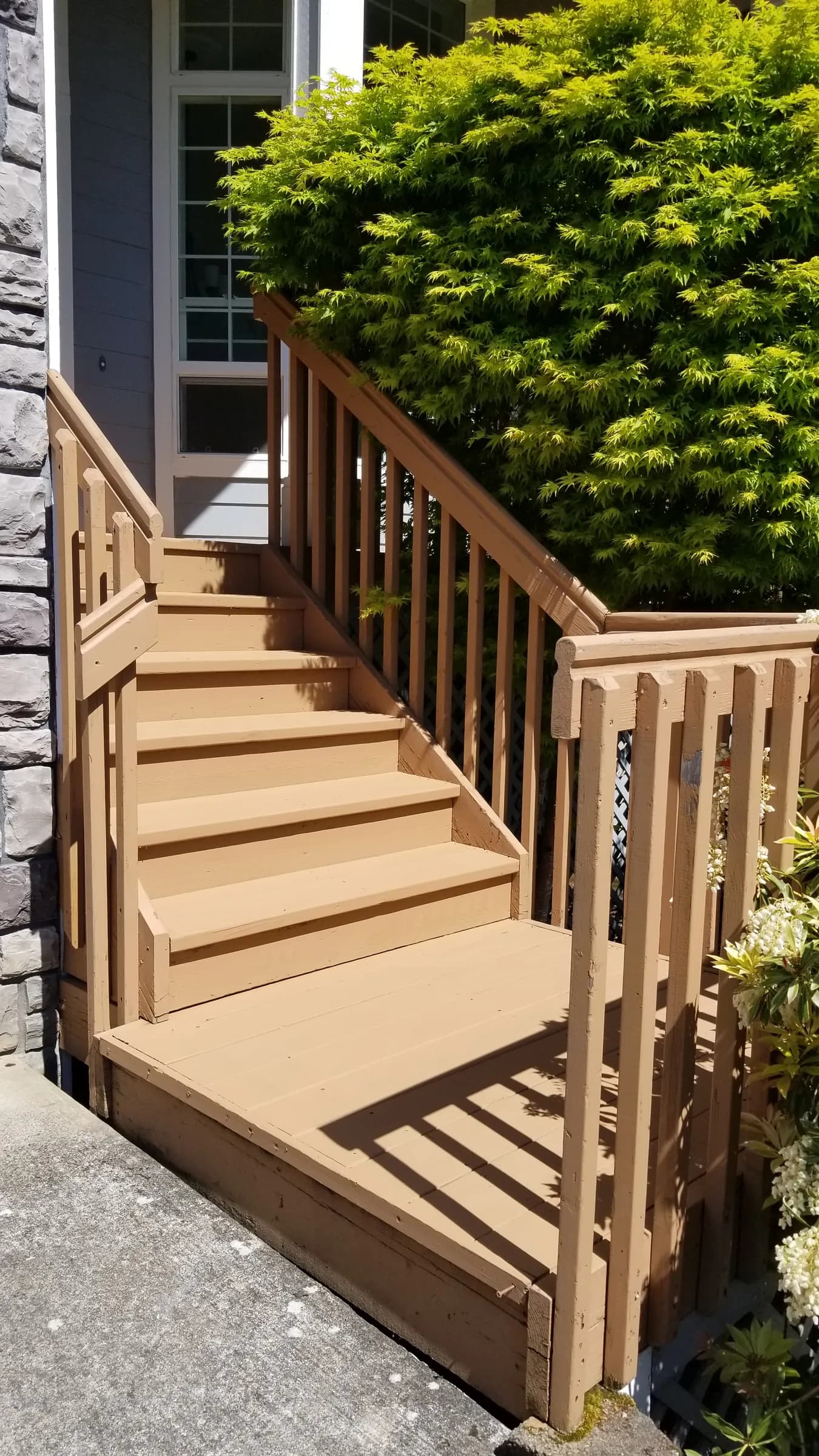 Done: The restored front-entry stairs and landing, finished to match the house.