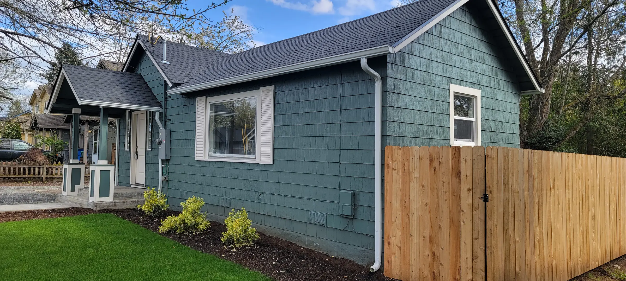 Done: Side elevation finished — new fence and lawn in.