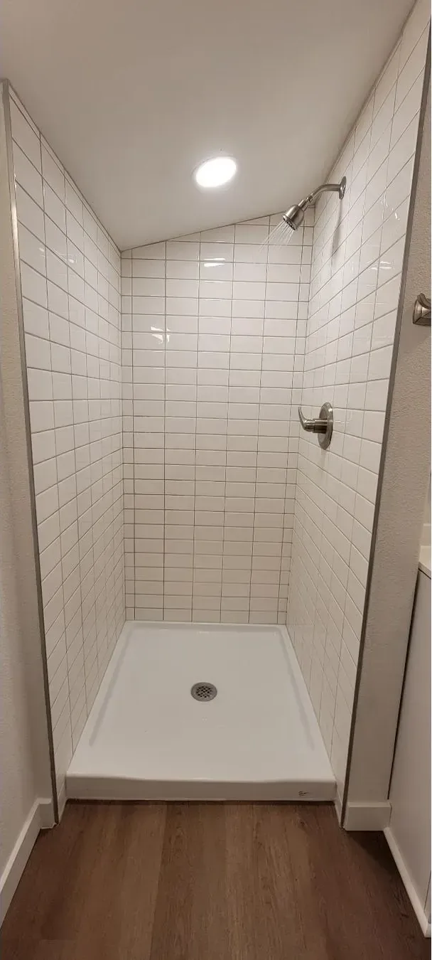 Done: New tiled shower with rainfall head.