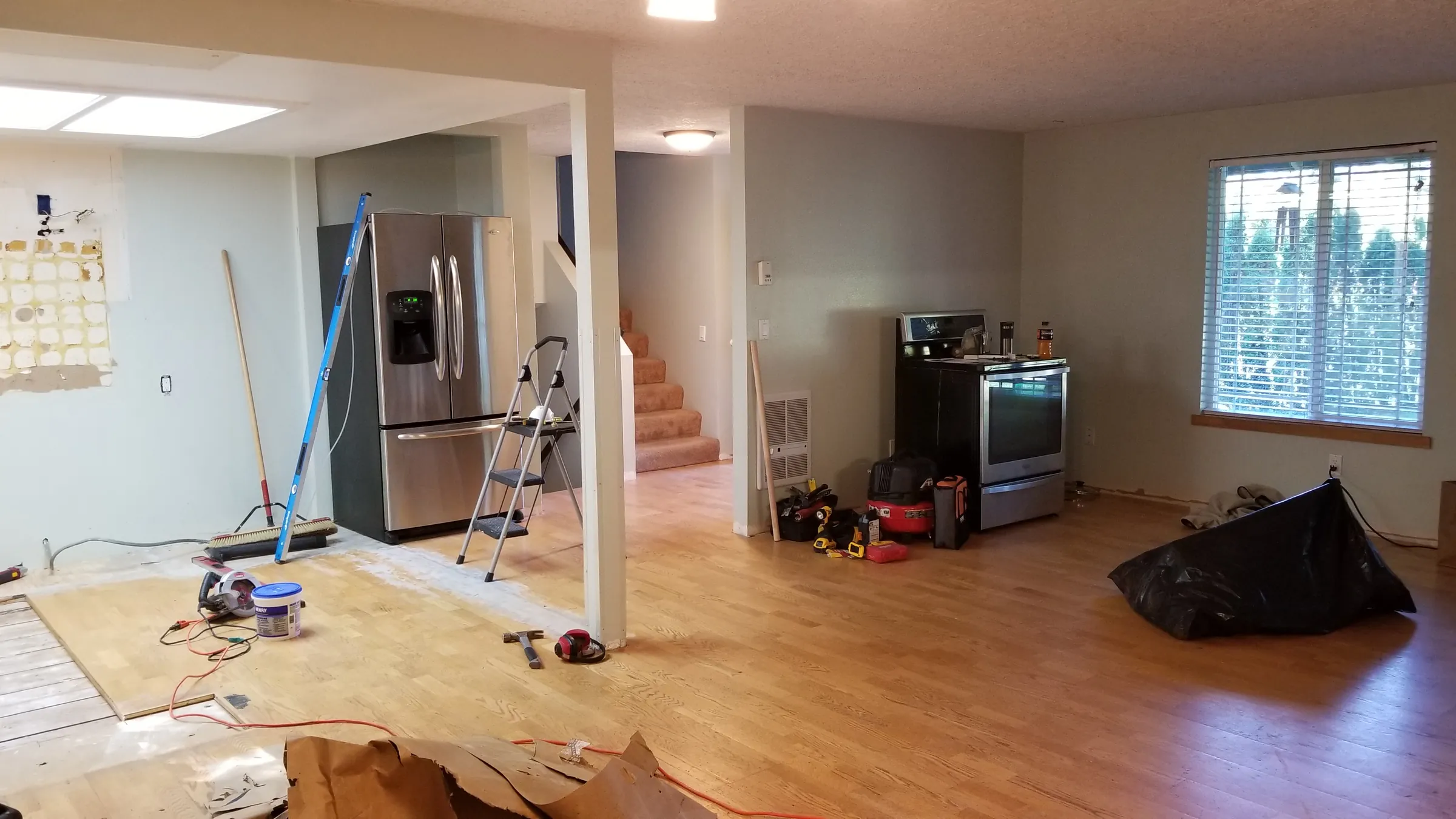 Demo: The opened-up kitchen and living area mid-demo.