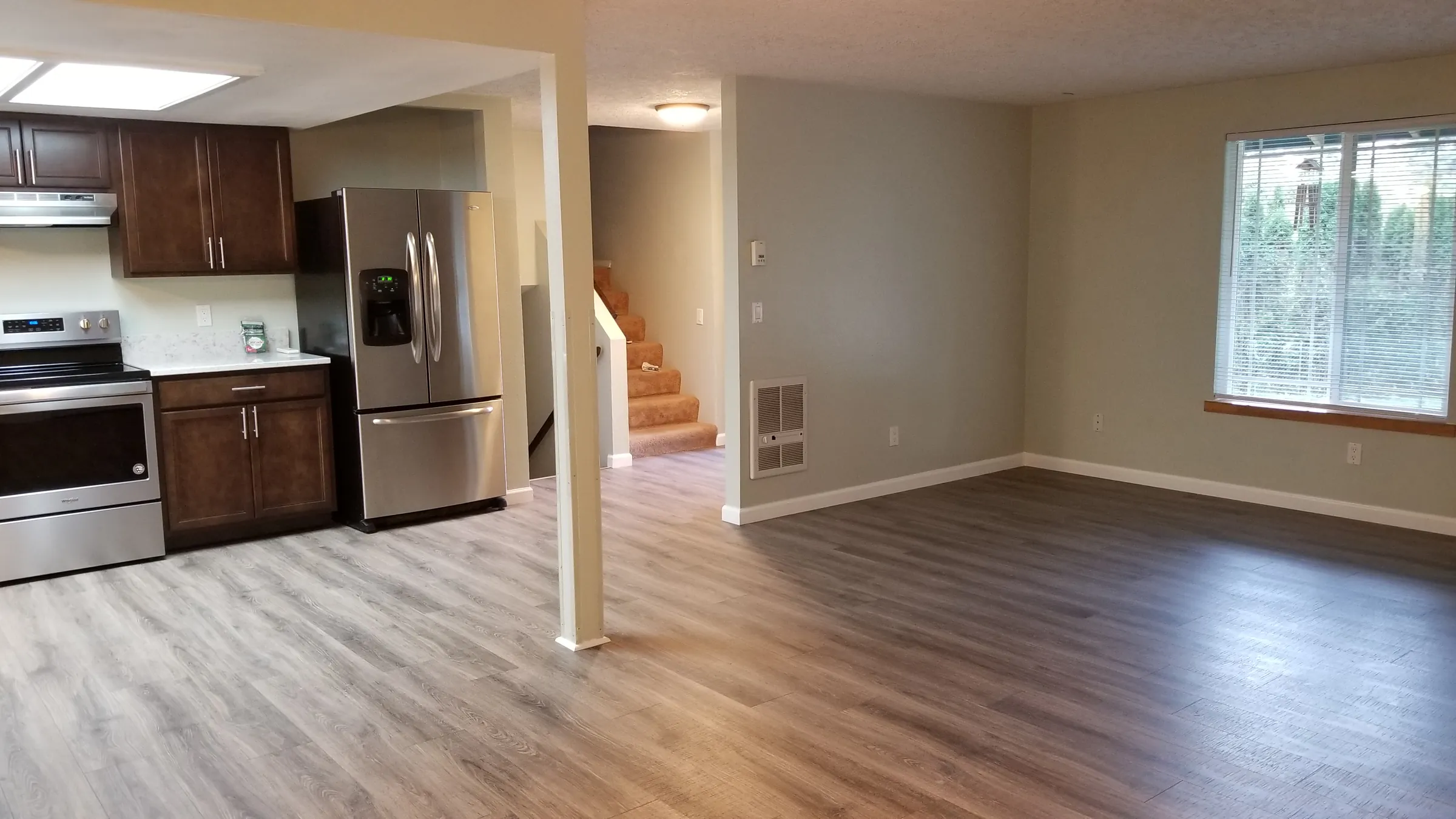 Done: Kitchen and the adjoining room with its new floor.