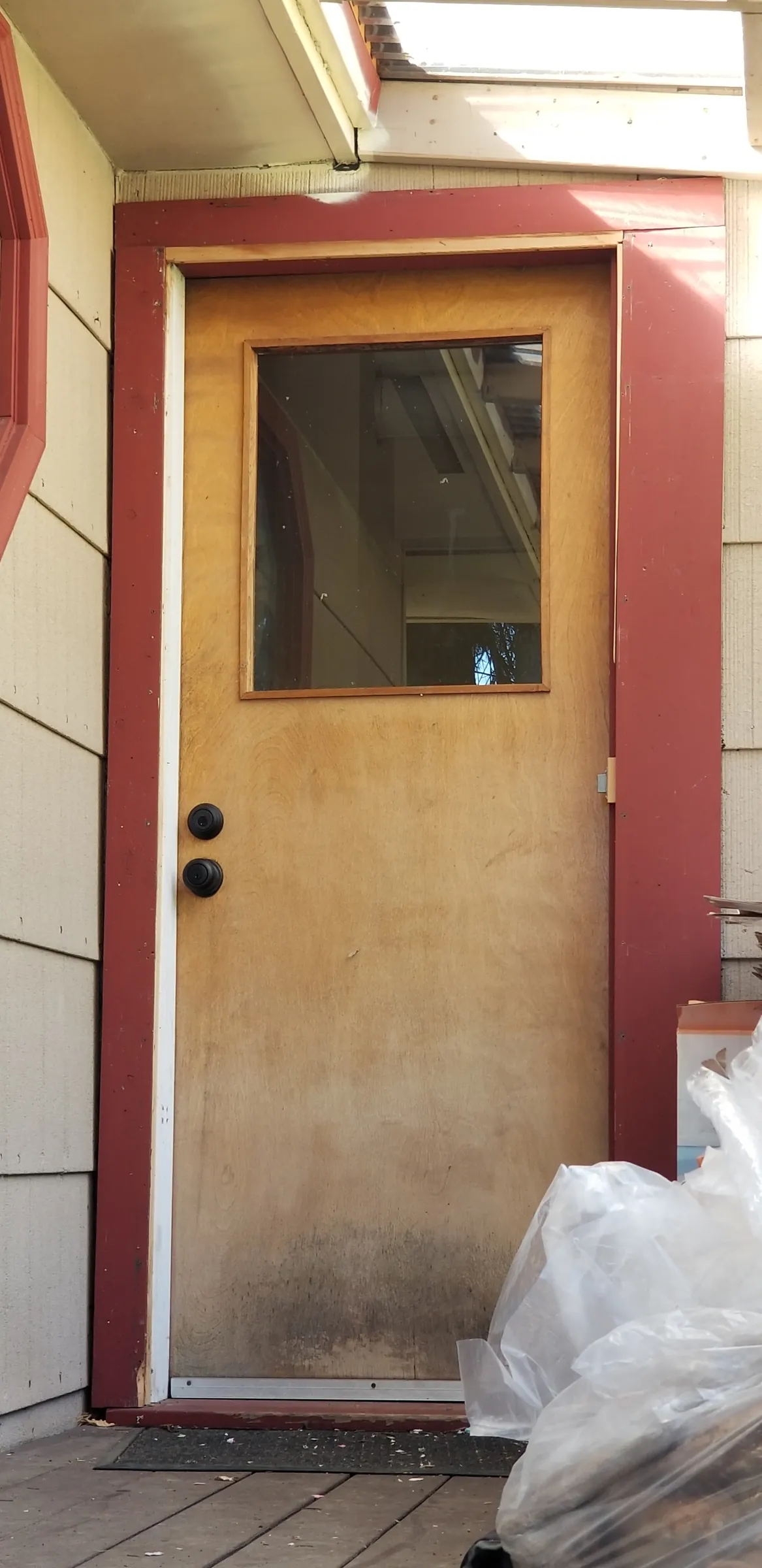 Repair: Exterior door stripped back to bare wood