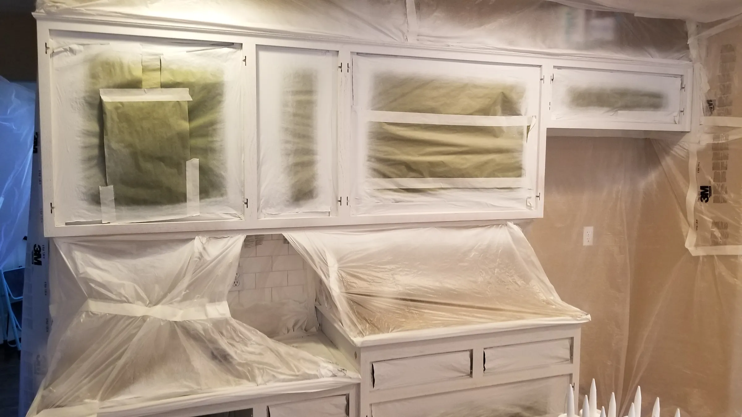 Paint: Upper cabinets and built-in desk masked and sprayed