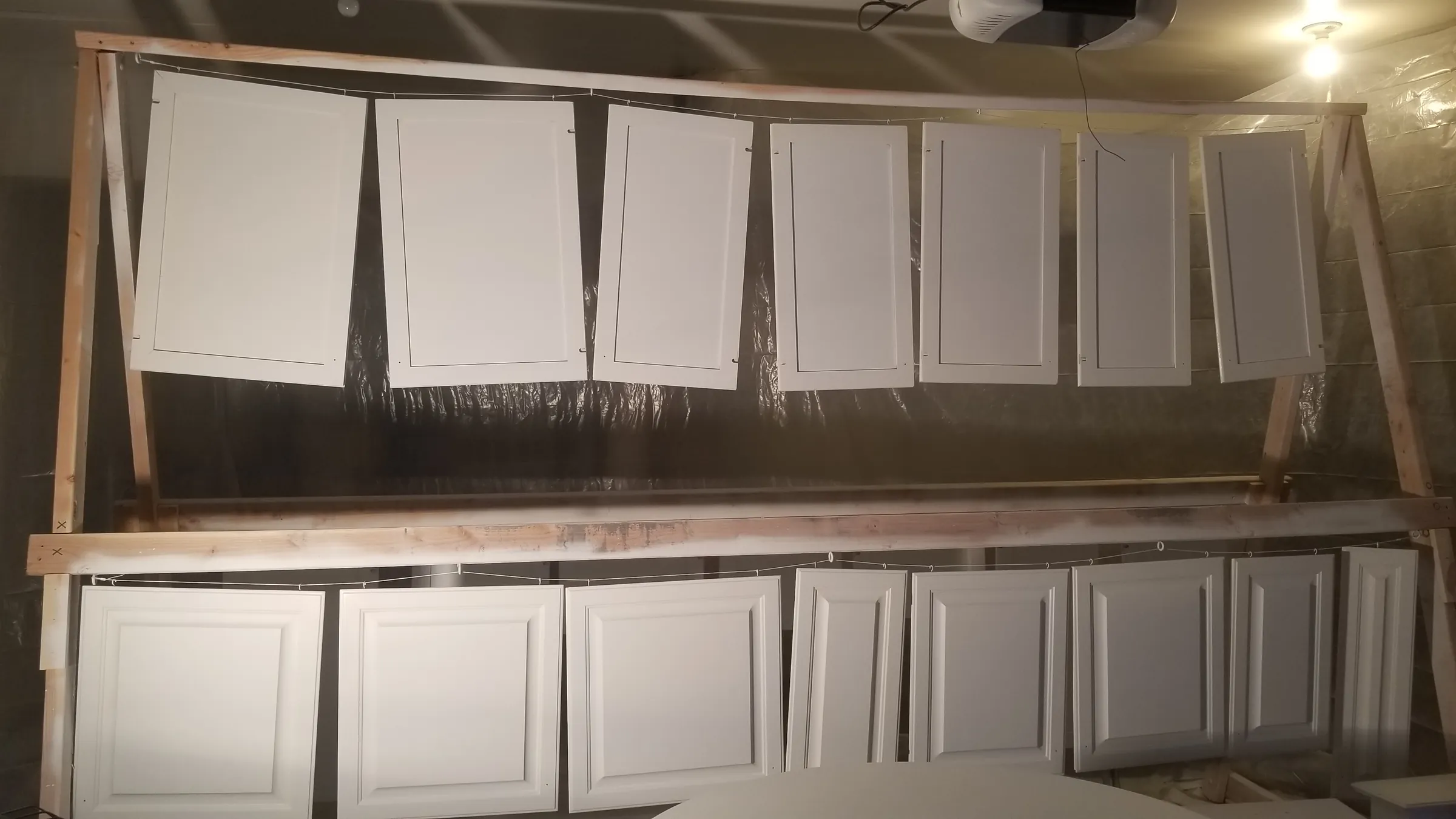 Paint: Finished doors racked and curing in the garage