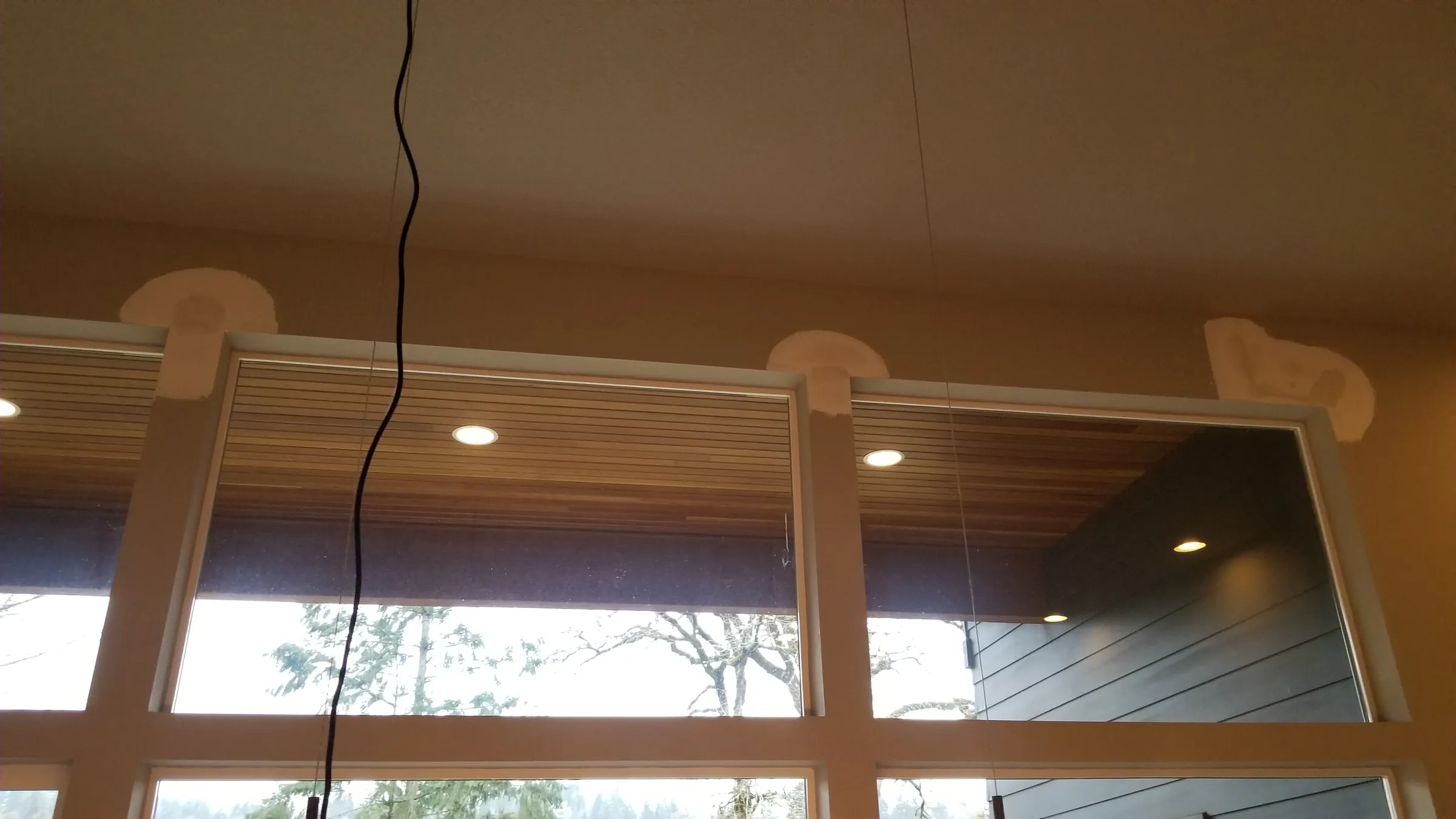 Paint: Masking and scaffold going up at the tall window wall.
