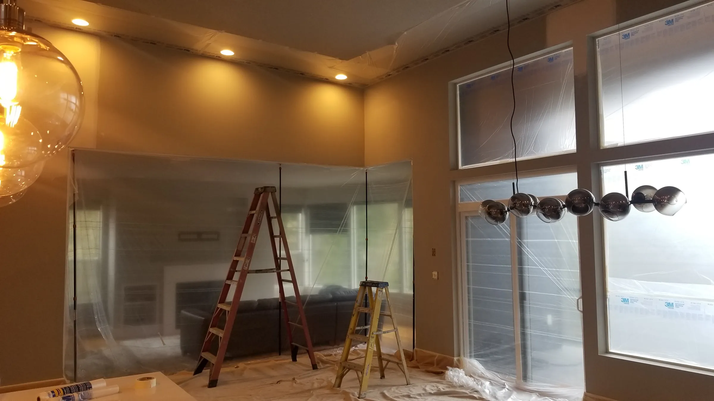 Paint: Plastic containment at the fireplace wall.
