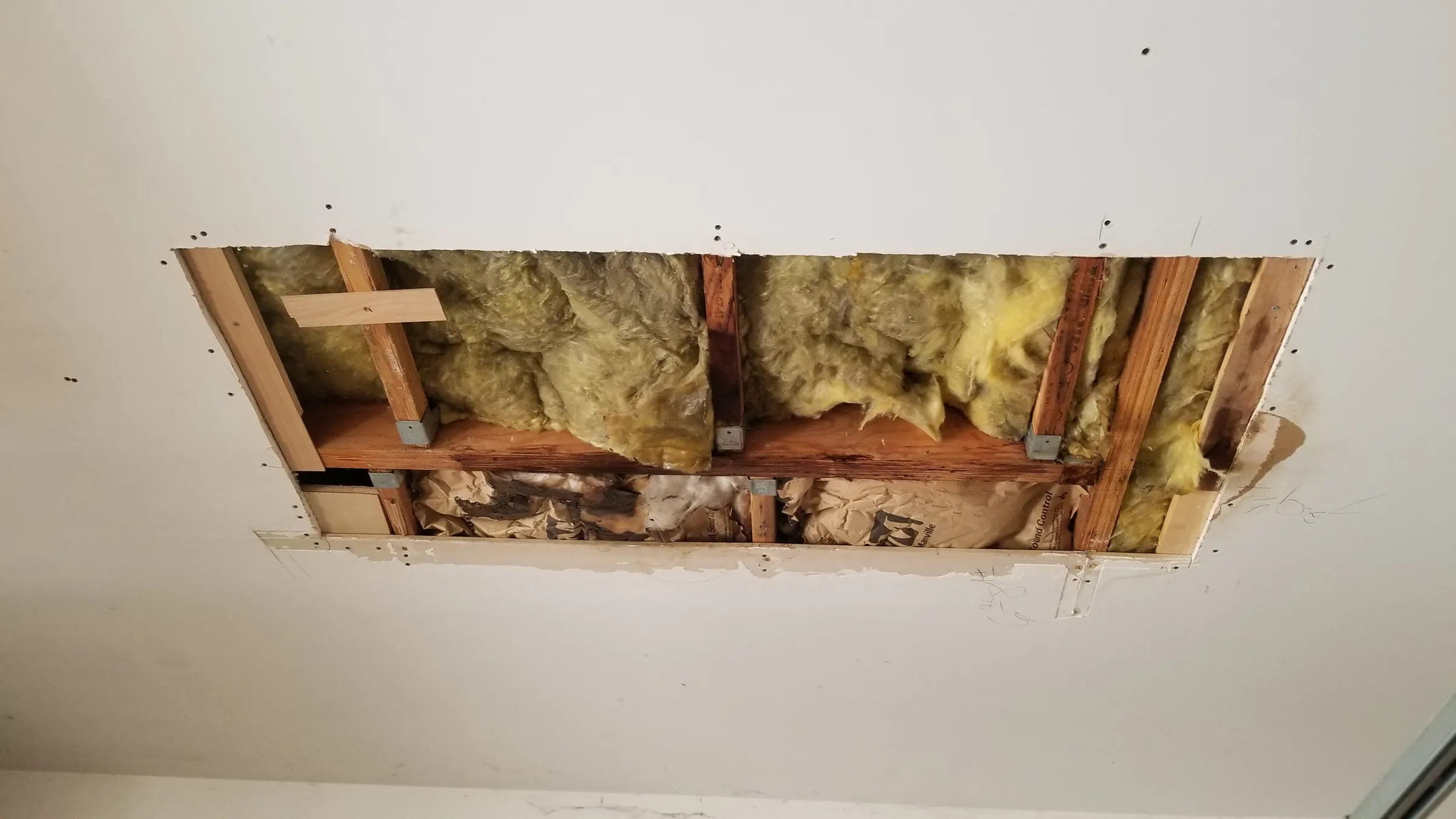 Repair: Ceiling opened: soaked insulation and stained framing
