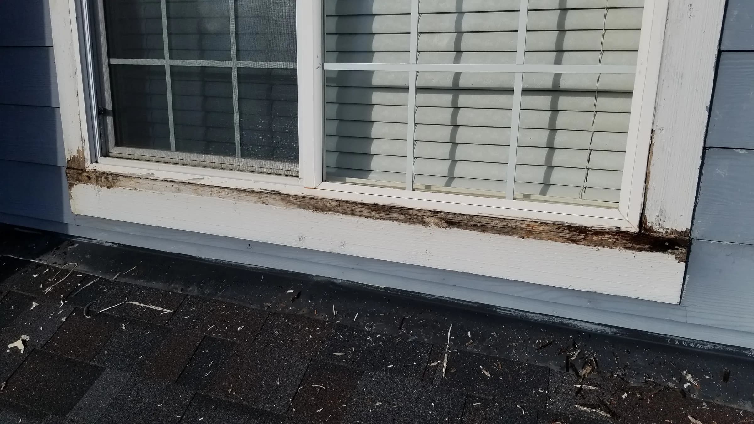 Before: The window wall before — rot along the whole sill