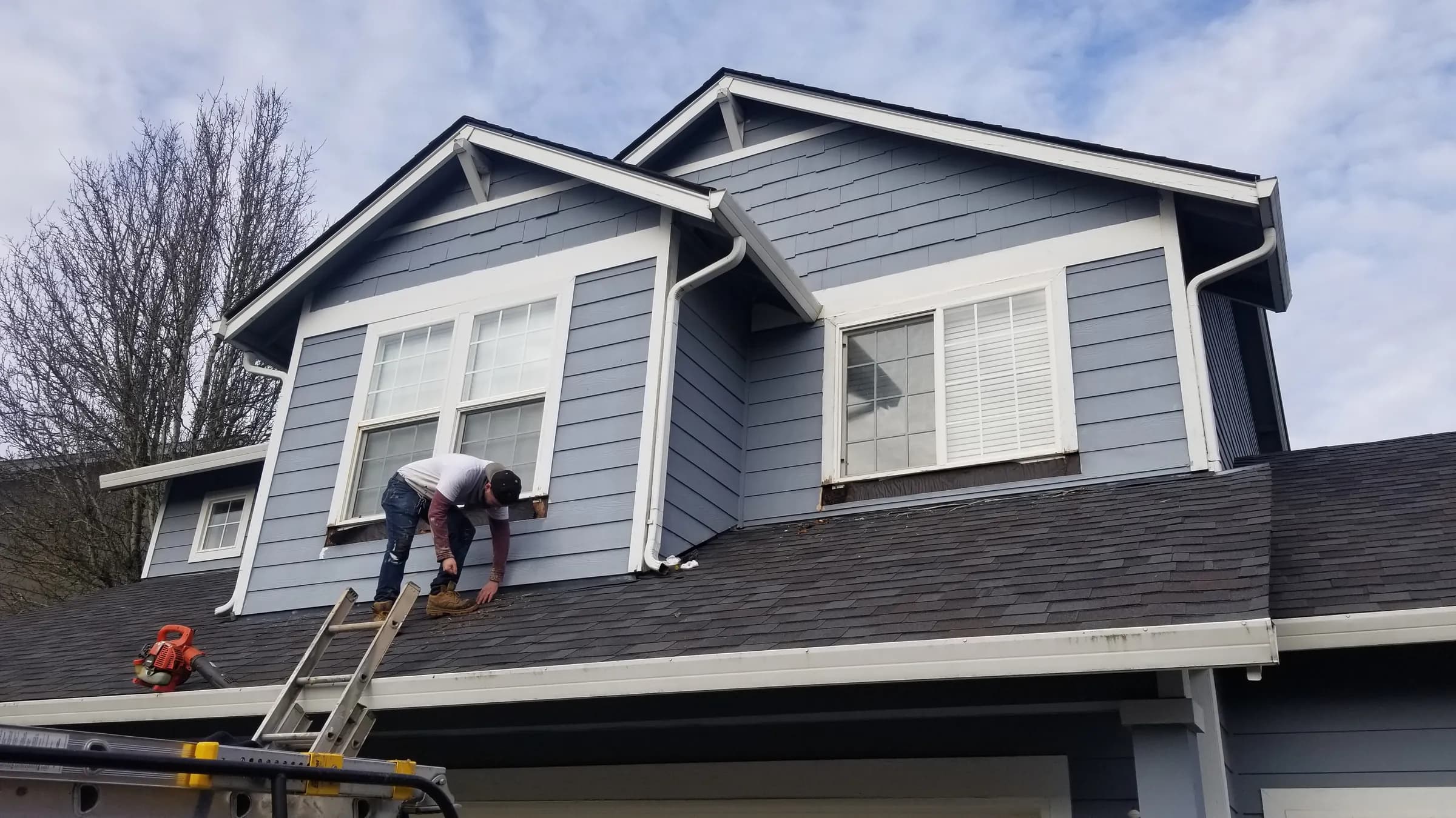 Repair: Crew on the roof at the dormer