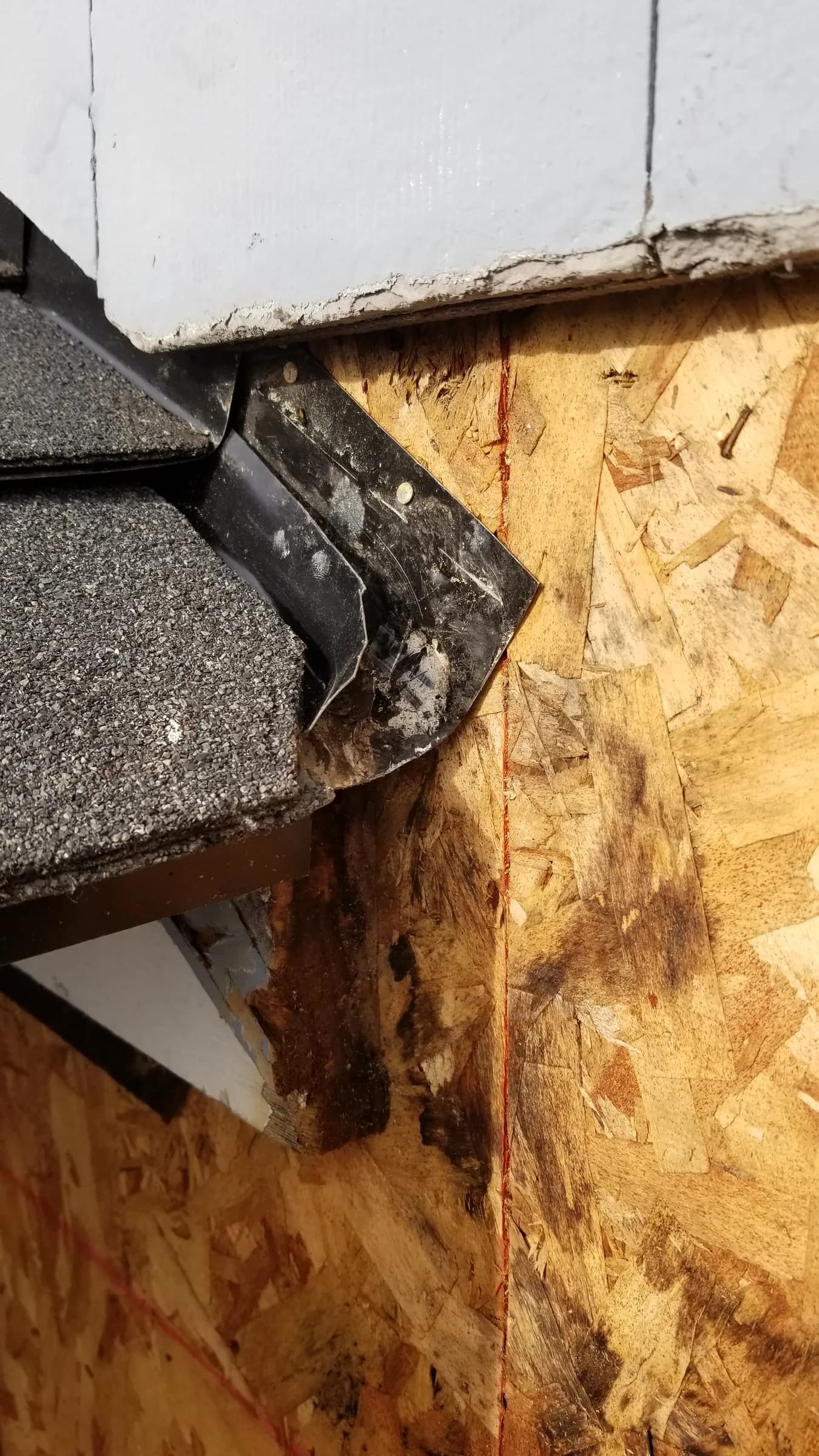 Repair: Rotted OSB sheathing at the roof junction