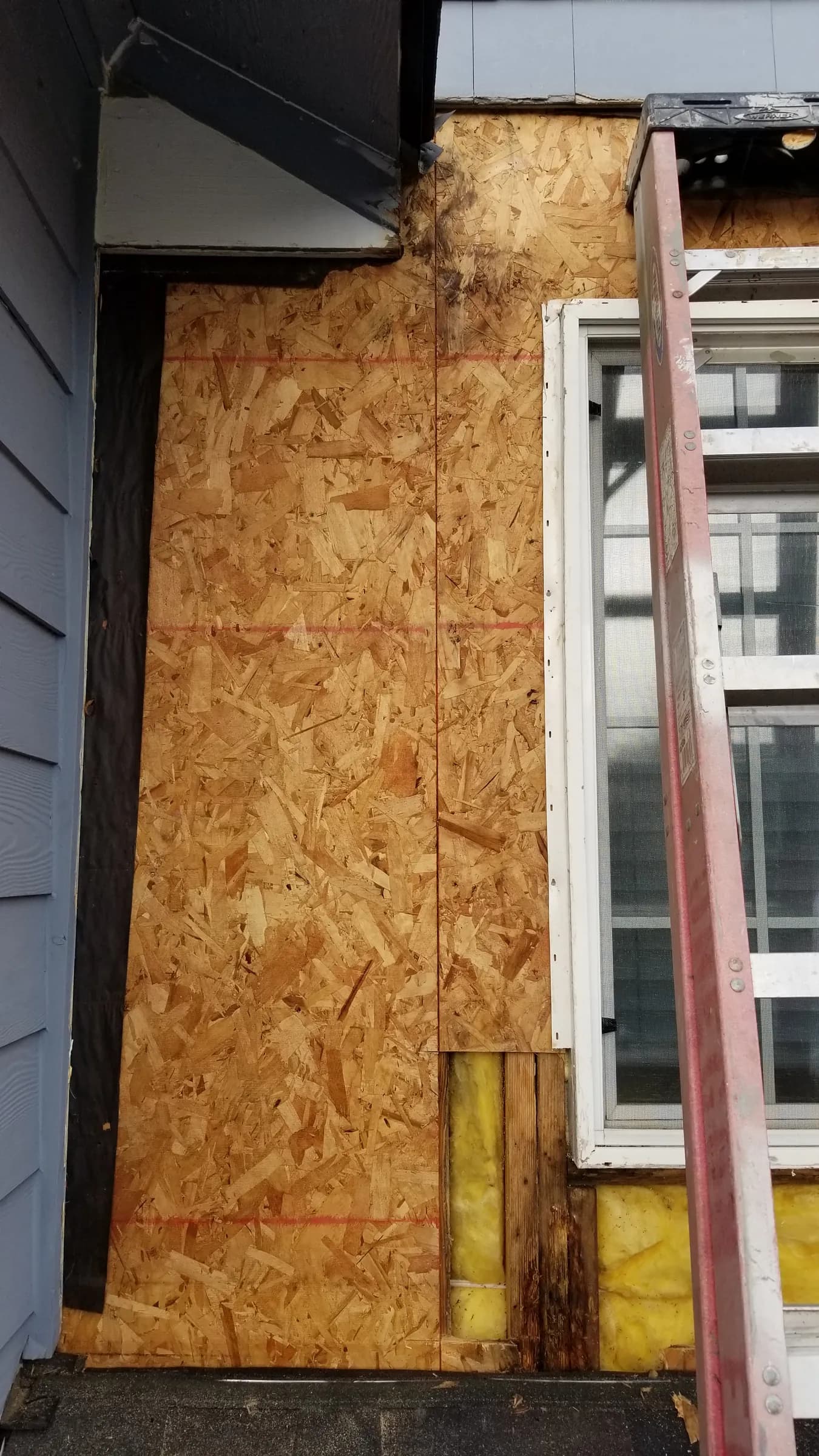 Install: New sheathing up the dormer wall