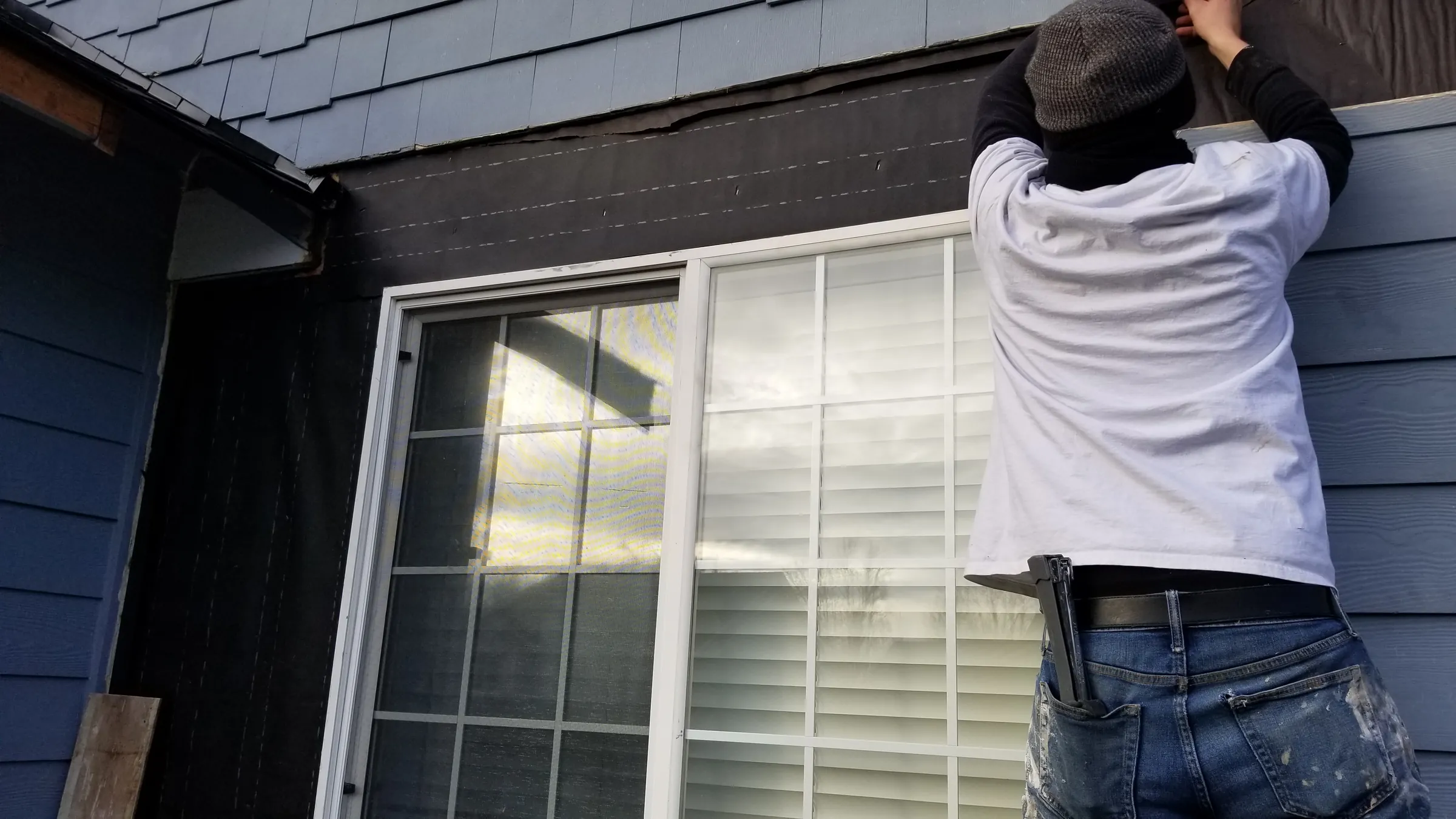 Install: Siding going back on, working from roof planks